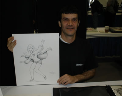Comic artist Steve Mannion with his Supergirl pinup